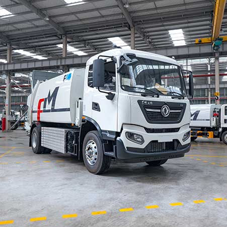 What is the difference between a side loader and a rear loader garbage truck?
