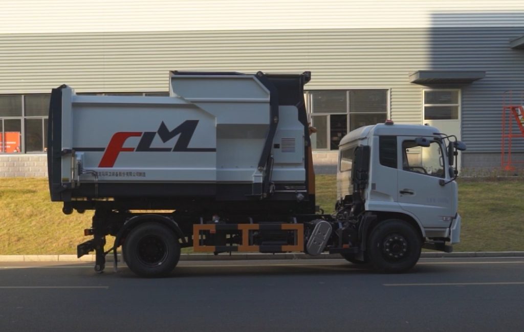Truck-mounted movable refuse compactor for municipal waste transport