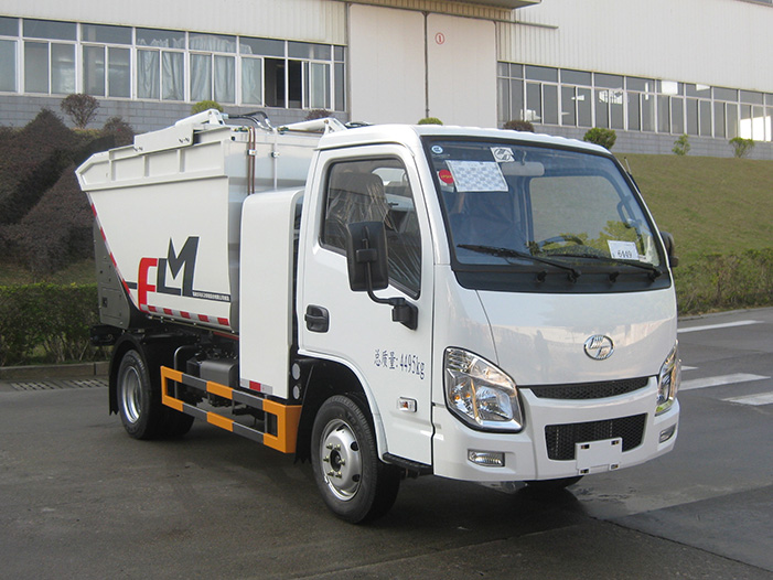 Side profile of a white FULONGMA self-loading garbage truck, model ES70, featuring the integrated waste container, FLM logo, and hydraulic lift arms